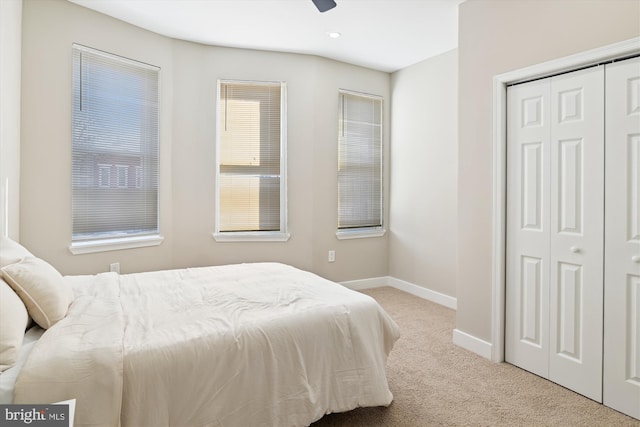 carpeted bedroom with a closet