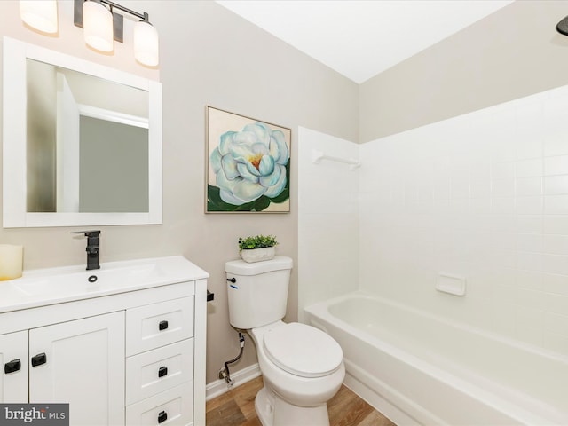 full bathroom featuring vanity, toilet, shower / washtub combination, and hardwood / wood-style floors