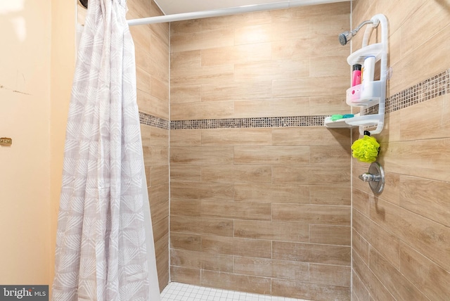 bathroom with a shower with shower curtain