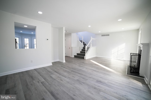 unfurnished living room with hardwood / wood-style floors