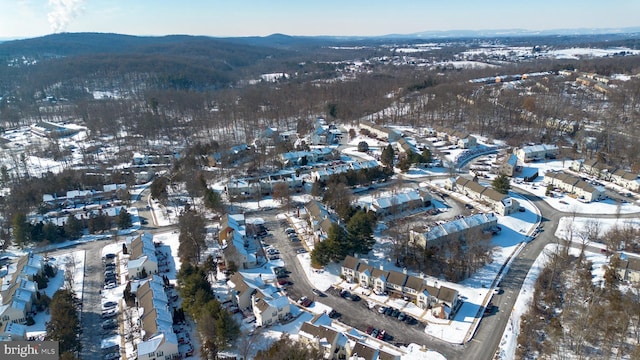 snowy aerial view with a mountain view