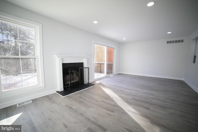 unfurnished living room with hardwood / wood-style floors