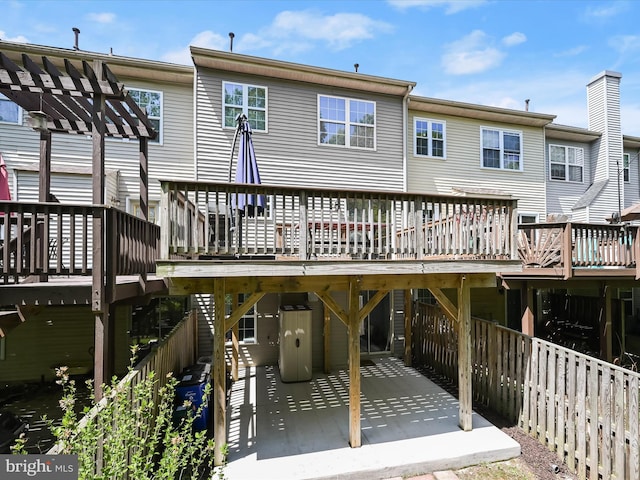 6422 Frothingham Ct, Elkridge, MD 21075 - rear view of property featuring a wooden deck, a pergola, and a carport