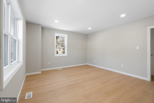 spare room with light wood-type flooring