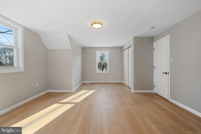 bonus room featuring light wood-type flooring