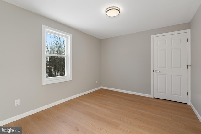 empty room with light hardwood / wood-style floors