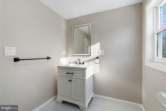 bathroom with plenty of natural light, tile patterned flooring, and vanity