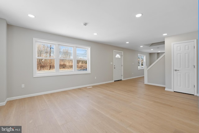 interior space featuring plenty of natural light and light hardwood / wood-style flooring