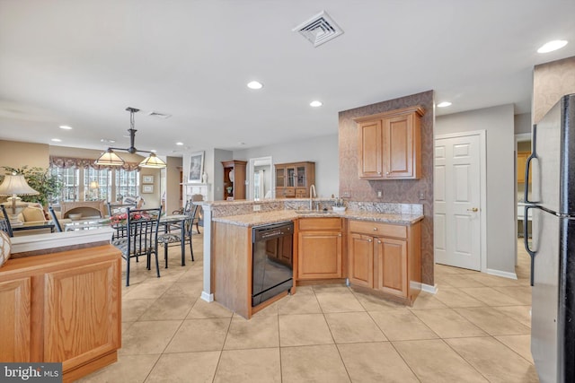 kitchen featuring sink, stainless steel refrigerator, kitchen peninsula, dishwasher, and pendant lighting