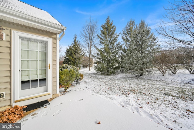 view of yard covered in snow