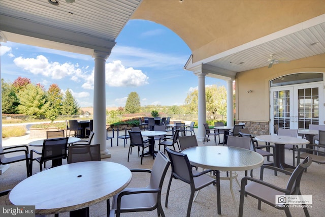 view of patio with french doors and ceiling fan