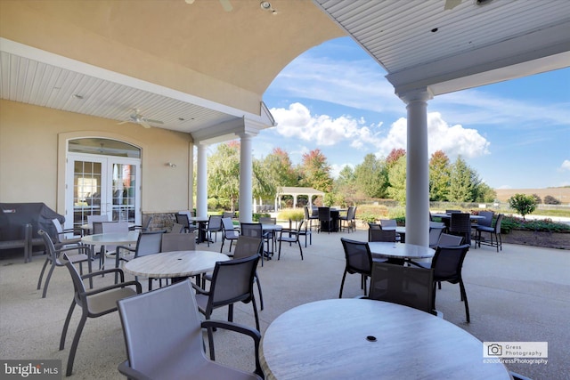 view of patio featuring a grill, ceiling fan, and french doors