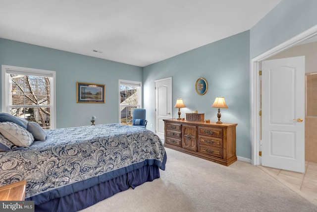 bedroom with light carpet