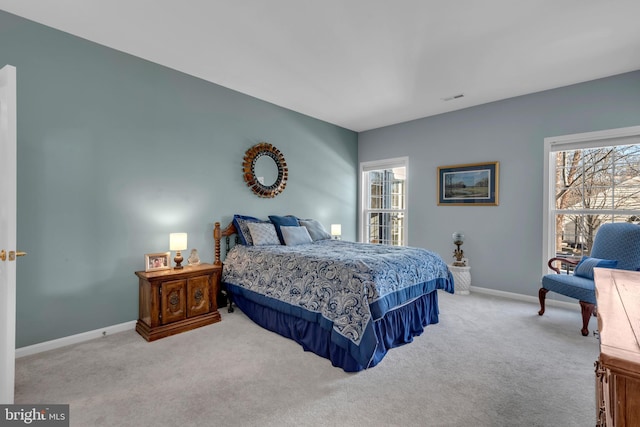 bedroom featuring light carpet