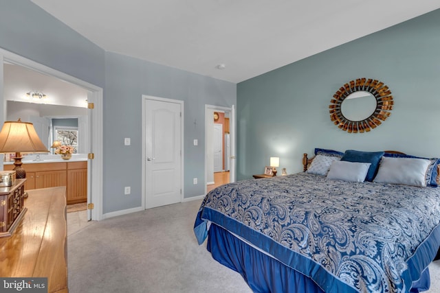 carpeted bedroom with ensuite bathroom