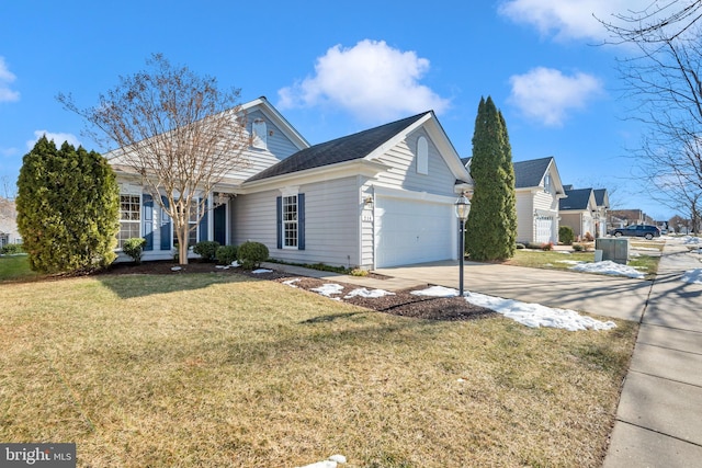 view of front facade with a garage and a front yard