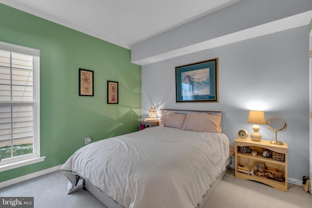 bedroom featuring light colored carpet