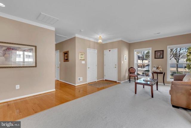 living room featuring crown molding and wood-type flooring