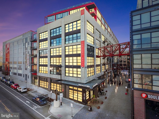 view of outdoor building at dusk