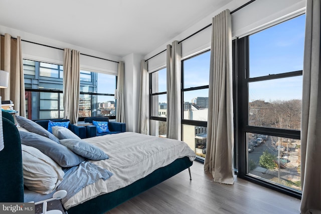 bedroom with hardwood / wood-style flooring