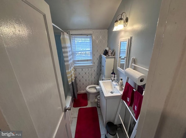 bathroom with vanity, a shower with curtain, and toilet