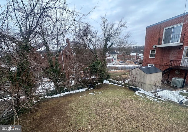 yard covered in snow with cooling unit