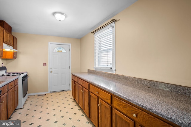 kitchen with white range with gas stovetop