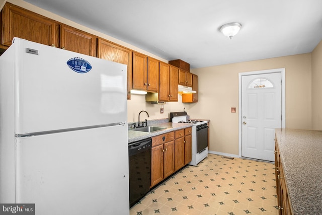 kitchen featuring sink and white appliances