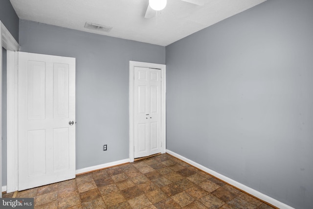 unfurnished bedroom with ceiling fan