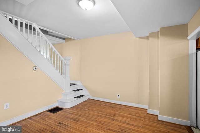 basement featuring wood-type flooring