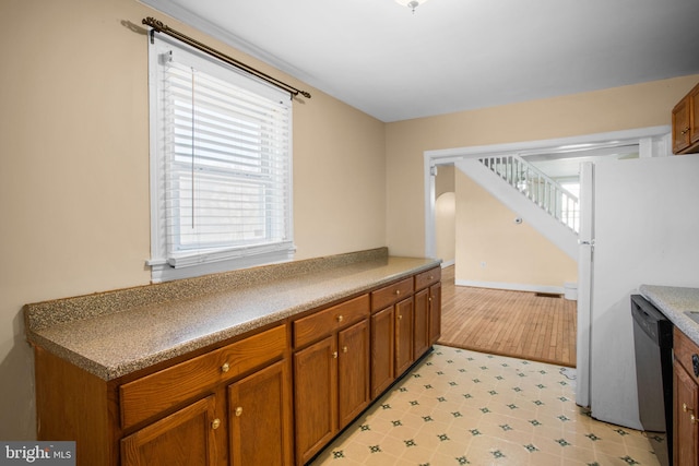 kitchen with white refrigerator and dishwasher