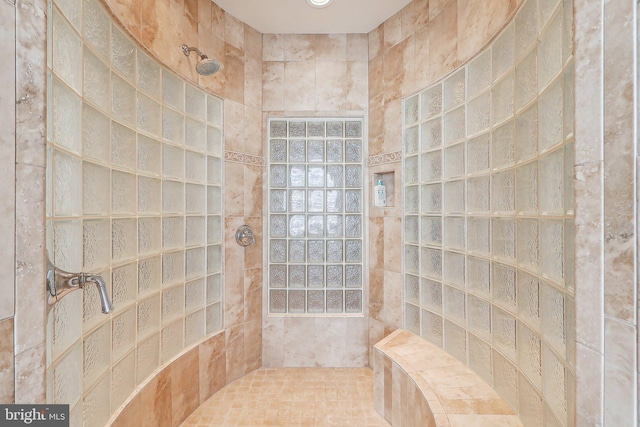 bathroom featuring a tile shower