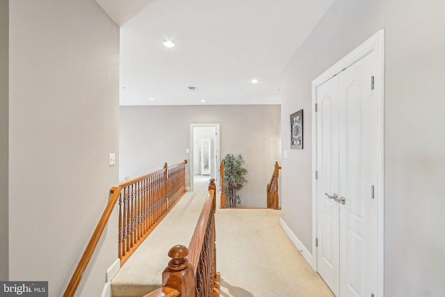 hallway with light carpet