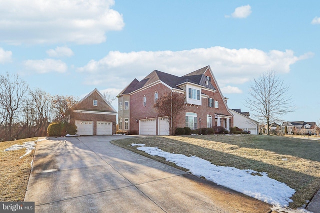 view of front facade with a garage and a front lawn