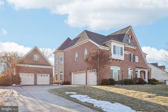 view of front of property with a garage and a front yard