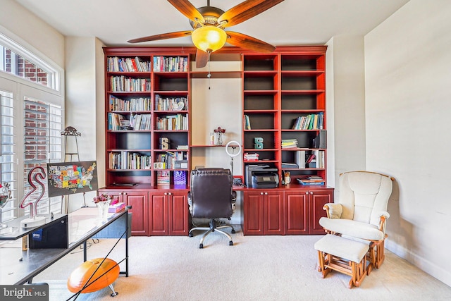 office area with ceiling fan and light colored carpet