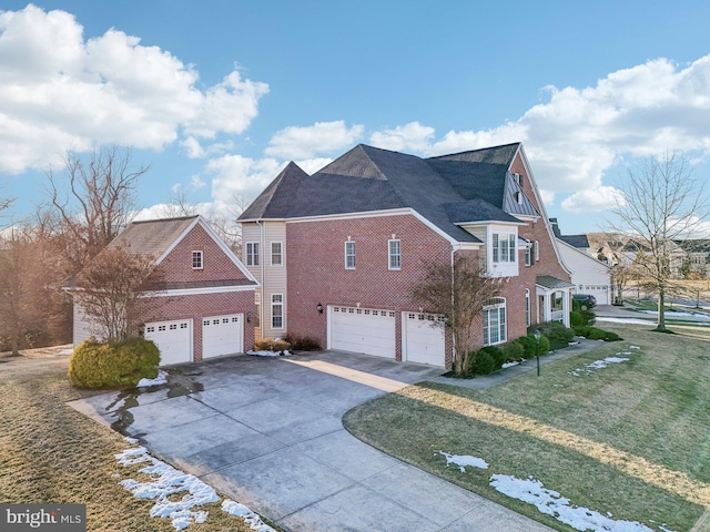 view of home's exterior with a garage and a yard