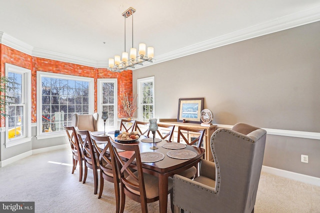 dining room featuring ornamental molding, light colored carpet, and a chandelier