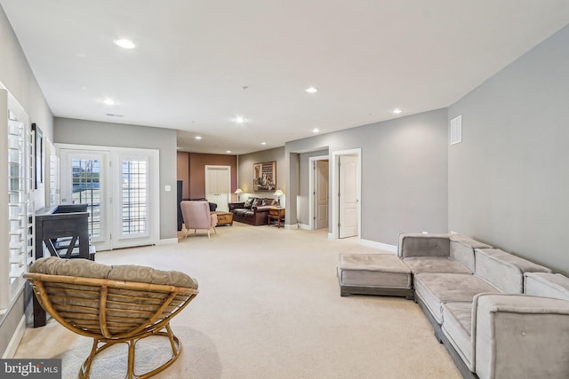 living room featuring light colored carpet