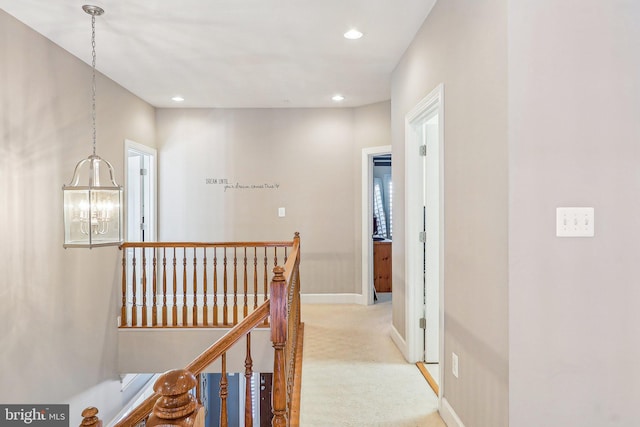 hallway with light carpet