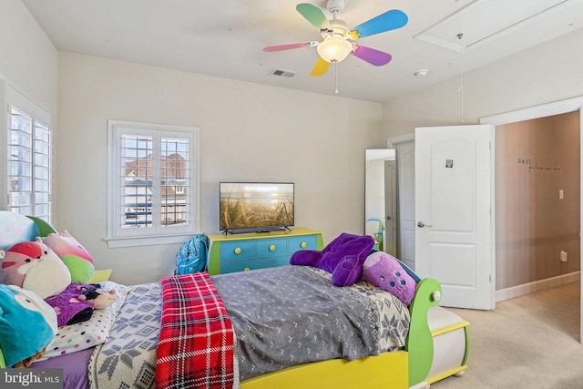 bedroom featuring light colored carpet and ceiling fan