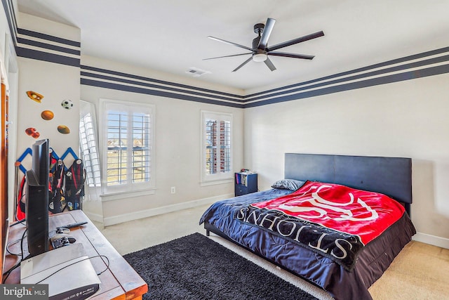 carpeted bedroom featuring ceiling fan