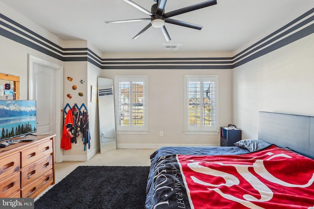 carpeted bedroom with ceiling fan