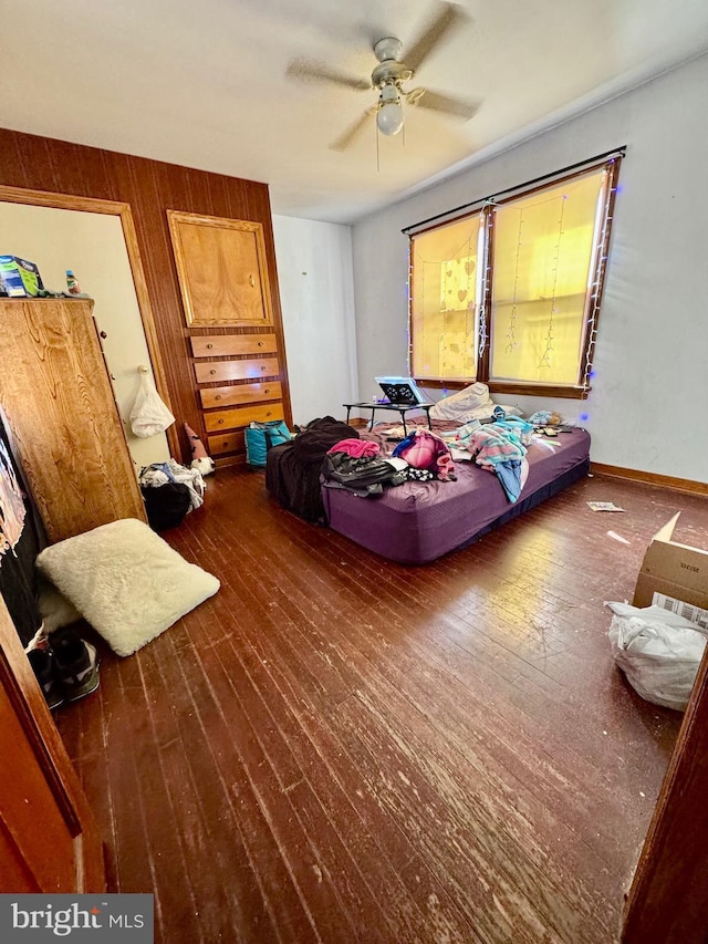 bedroom featuring dark wood-type flooring and ceiling fan