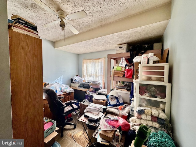 home office with a textured ceiling and ceiling fan