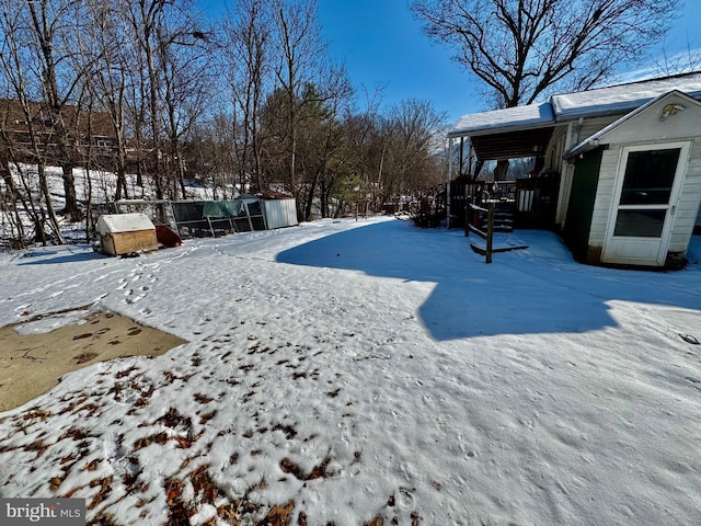 view of yard layered in snow