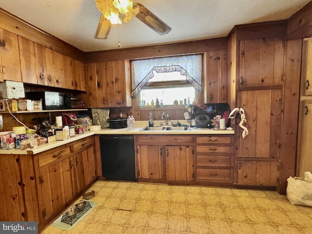 kitchen with ceiling fan, black dishwasher, and sink