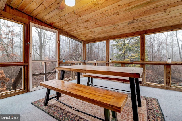 sunroom with lofted ceiling and wooden ceiling