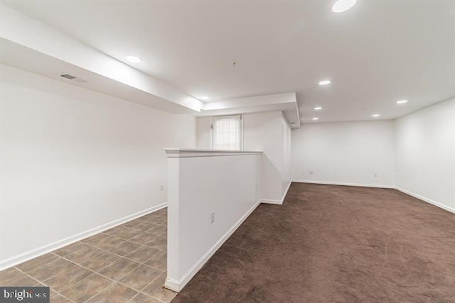 below grade area with visible vents, baseboards, and recessed lighting