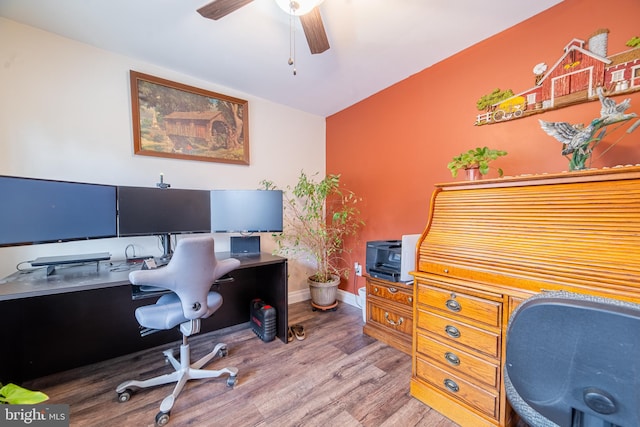 office space featuring wood-type flooring and ceiling fan